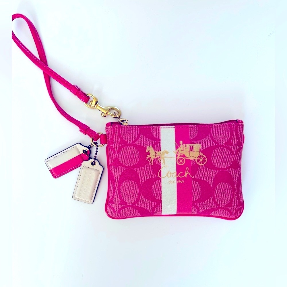 Coach wristlet with iconic horse and carriage logo.